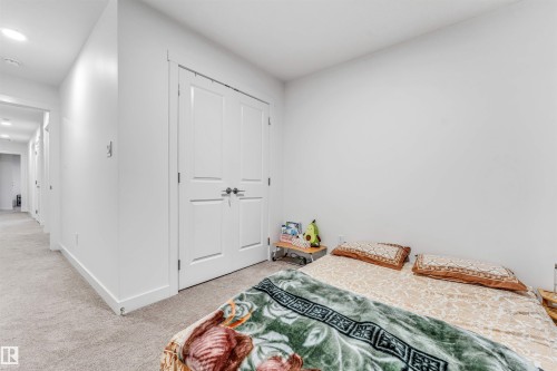 Neutral-toned carpeting throughout provides a soft underfoot - 45 2710 66 Street, Edmonton, AB 