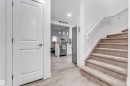 Carpeted staircase with white handrail, leading to an upper level - 45 2710 66 Street, Edmonton, AB 