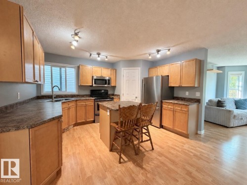 105 Keystone Crescent, Leduc, AB - Indoor Photo Showing Kitchen With Double Sink