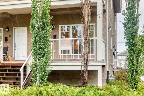 Multi-story townhouse exterior with a textured facade - 4 11917 103 Street, Edmonton, AB 