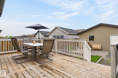 Spacious wood deck with white railing system - 33 Durrand Bend, Fort Saskatchewan, AB 
