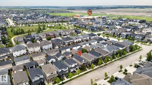 Suburban neighborhood with established residential properties and manicured green spaces - 33 Durrand Bend, Fort Saskatchewan, AB 