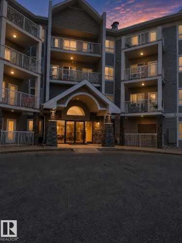 Multi-story residential building featuring balconies with white railings - 115 5340 199 Street, Edmonton, AB - Outdoor