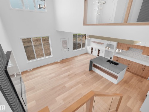 Open-concept living space featuring high ceilings, light wood-finish flooring, and abundant natural light from large windows - 214 Crystal Creek Drive, Leduc, AB 