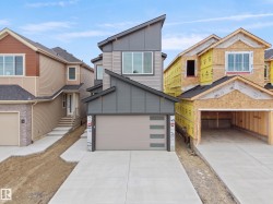 Modern architectural design featuring a multi-tone gray exterior and a distinctive angular roofline - 