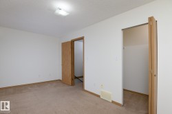 Neutral-toned carpeting paired with light walls and wood-finish trim - 