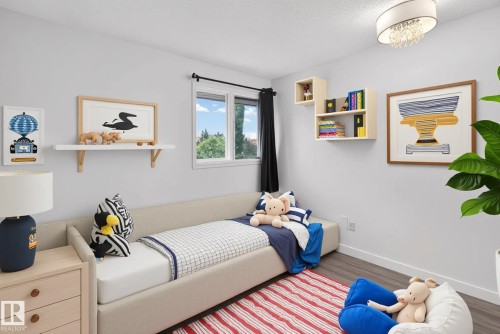 Neutral wall paint and wood-finish flooring characterize this room - 14808 55 Street, Edmonton, AB 
