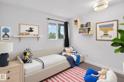 Neutral wall paint and wood-finish flooring characterize this room - 