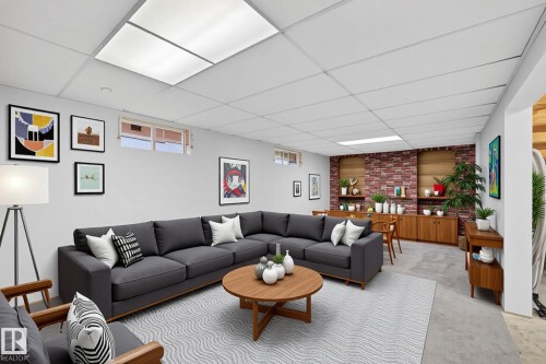 Spacious recreation room featuring light gray walls, carpet flooring, and a drop ceiling with integrated lighting - 14808 55 Street, Edmonton, AB 