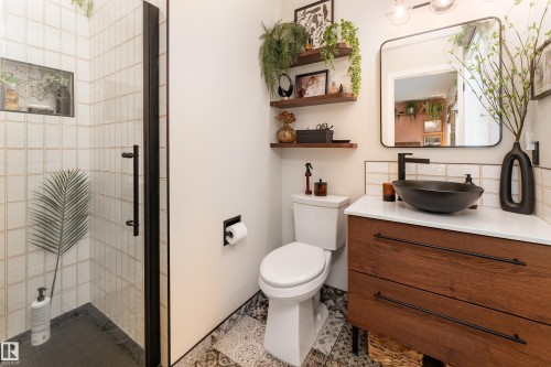 Upgraded contemporary ensuite with clear glass and matte black framed shower and floating vanity - 5964 South Terwillegar Boulevard, Edmonton, AB 