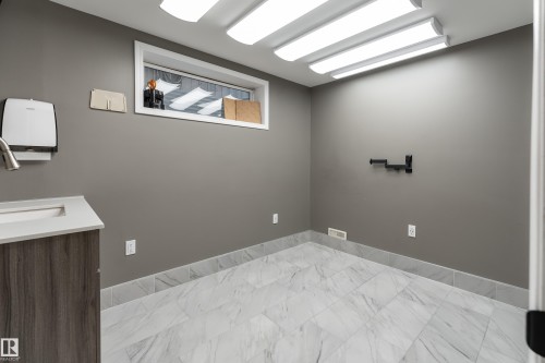 3rd bedroom in basement with large window, closet and sink, currently used for home-based business - 5964 South Terwillegar Boulevard, Edmonton, AB 