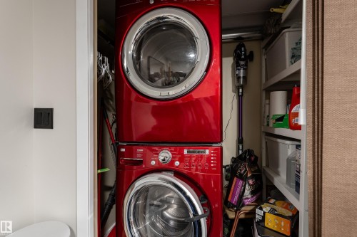 Dedicated laundry closet featuring a stacked washer and dryer - 5964 South Terwillegar Boulevard, Edmonton, AB 