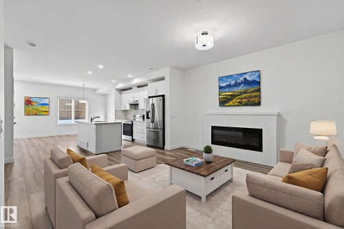 4853 Alwood Point(E), Edmonton, AB - Indoor Photo Showing Living Room With Fireplace