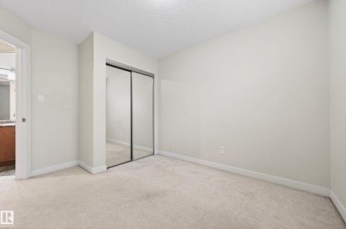 Wall-to-wall carpeting and neutral wall tones create a versatile interior - 48 8716 179 Avenue, Edmonton, AB 
