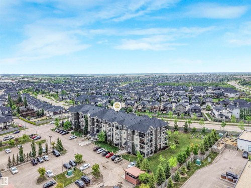 Multi-story residential building featuring dark roofing, light-toned siding, and private balconies - 1103 2 Augustine Crescent, Sherwood Park, AB 
