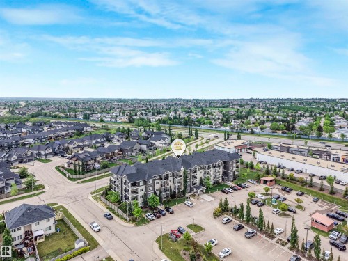 Multi-story residential building featuring balconies and a dedicated parking area - 1103 2 Augustine Crescent, Sherwood Park, AB 