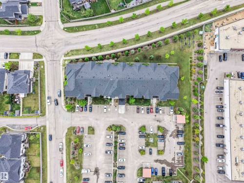 Multi-unit residential building featuring a dark shingled roof and individual entryways - 1103 2 Augustine Crescent, Sherwood Park, AB 