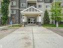 Multi-story building featuring stacked stone and horizontal siding facade - 1103 2 Augustine Crescent, Sherwood Park, AB 