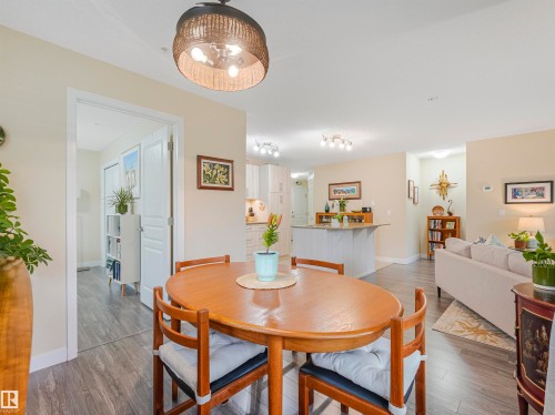 Open-concept living space featuring wood-finish flooring, recessed lighting, and light neutral wall colors - 1103 2 Augustine Crescent, Sherwood Park, AB 
