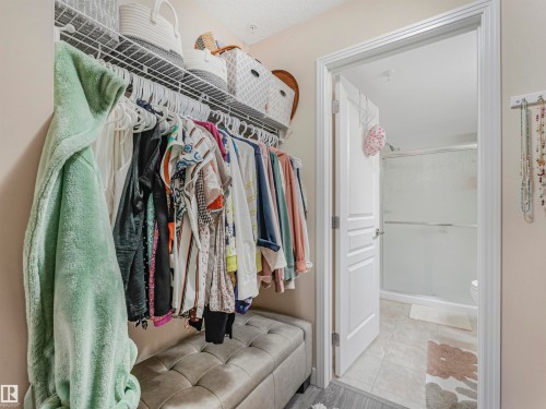 Built-in closet system with upper shelving and hanging rods - 1103 2 Augustine Crescent, Sherwood Park, AB 