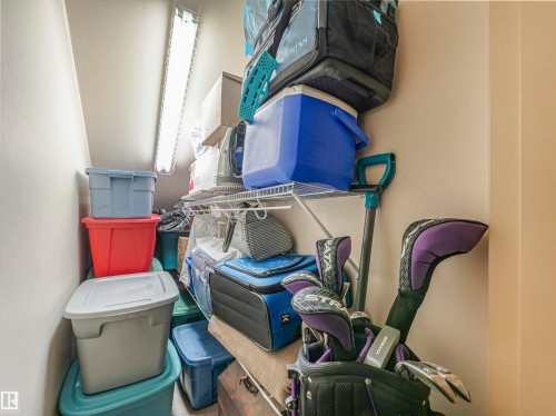 Storage closet featuring a wire shelving system and overhead fluorescent lighting - 1103 2 Augustine Crescent, Sherwood Park, AB 