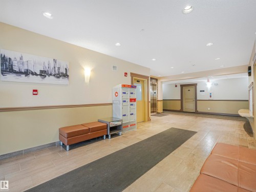 Lobby area featuring tile flooring, recessed lighting, and wall sconces - 1103 2 Augustine Crescent, Sherwood Park, AB 