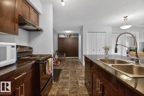 414 1060 Mcconachie Boulevard, Edmonton, AB - Indoor Photo Showing Kitchen With Double Sink