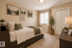 Bedroom featuring neutral wall paint, a window with blinds and drapes, and a built-in closet with bi-fold doors - 