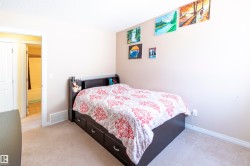 Carpeted room with light neutral walls and baseboards - 