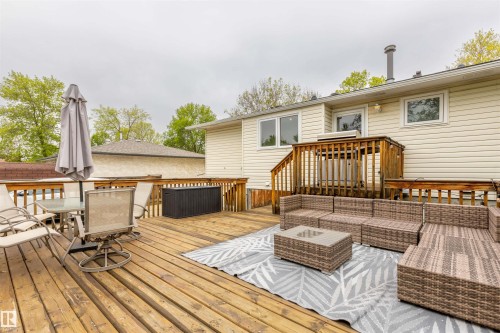 Expansive wooden deck featuring multiple levels and wood railings - 33 Andrew Crescent, St. Albert, AB 