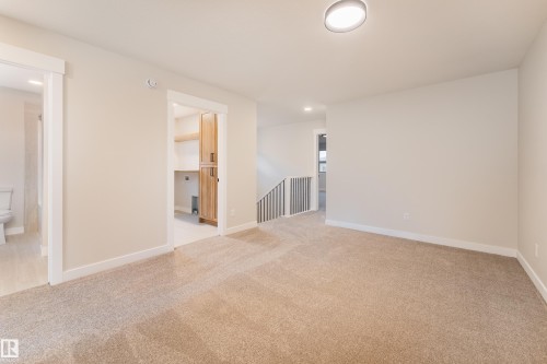 Carpeted landing with flush-mount ceiling light - 115 Garneau Gate, Spruce Grove, AB 