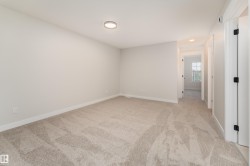 Neutral-toned wall paint and carpeting create a versatile interior - 