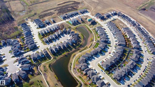 Aerial perspective showcasing a residential community with a large collection of detached homes - 115 Garneau Gate, Spruce Grove, AB 