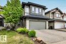 Contemporary two-story residence featuring a neutral-toned exterior with horizontal siding and accent panels - 1107 Chahley Crest, Edmonton, AB 