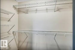 White wire shelving system with multiple tiers - 