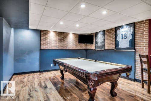 Finished lower level featuring wood-finish flooring and recessed lighting - 1107 Chahley Crest, Edmonton, AB 
