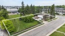 Aerial perspective showcasing a property with significant green space and mature trees - 13908 64 Street, Edmonton, AB 