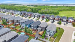 Newer residential development featuring varied architectural styles and a verdant natural backdrop - 