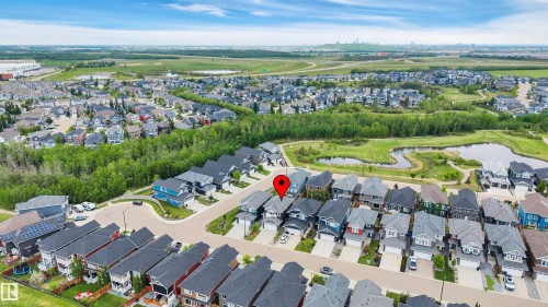 Aerial perspective of a residential community featuring varied architectural styles and mature landscaping - 3898 Robins Crescent, Edmonton, AB 