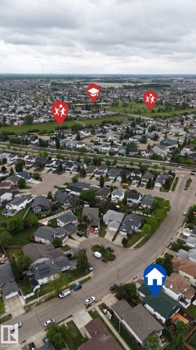 Aerial perspective of a residential neighborhood featuring detached homes with varied rooflines and landscaped yards - 3928 30 Street, Edmonton, AB 