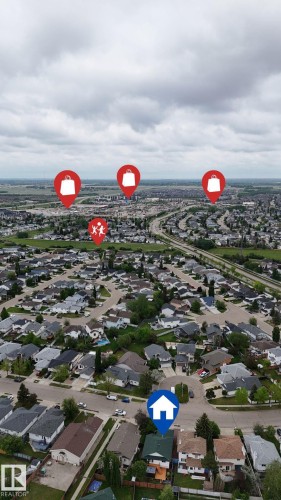 Aerial perspective showcasing a residential neighborhood with numerous single-family homes - 3928 30 Street, Edmonton, AB 