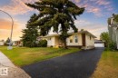Ranch-style residence featuring light-toned siding and a brick accent facade - 17932 93 Avenue, Edmonton, AB 