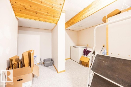 Basement space featuring light-colored carpet flooring and exposed wood ceiling beams - 17932 93 Avenue, Edmonton, AB 