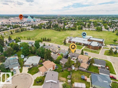Residential neighborhood with varied single-family homes, mature trees, and paved streets - 17932 93 Avenue, Edmonton, AB 