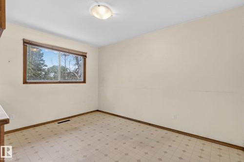 Room featuring neutral wall finishes and patterned sheet flooring - 13920 64 Street, Edmonton, AB 