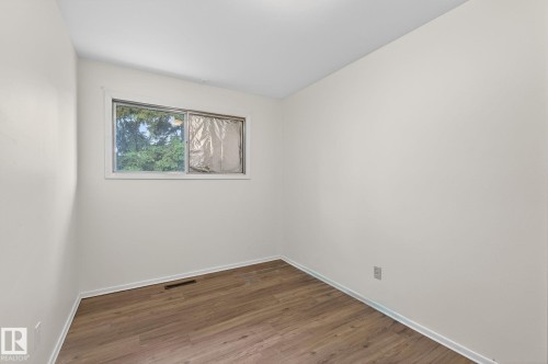 Neutral wall paint with wood-finish flooring - 13920 64 Street, Edmonton, AB 