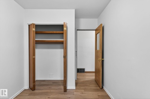 Interior space featuring wood-finish flooring - 13920 64 Street, Edmonton, AB 