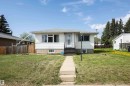 White siding residence with a grey shingled roof and a concrete front walkway - 4414 54 Avenue, Barrhead, AB  - Outdoor 