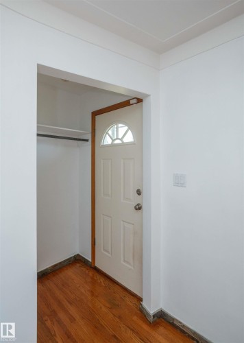 Entryway featuring a paneled door with an arched transom window - 4414 54 Avenue, Barrhead, AB - Indoor Photo Showing Other Room