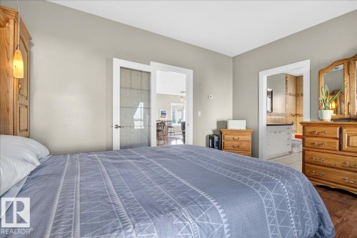 Hardwood-style flooring throughout - 5019 48 Avenue, Chipman, AB - Indoor Photo Showing Bedroom
